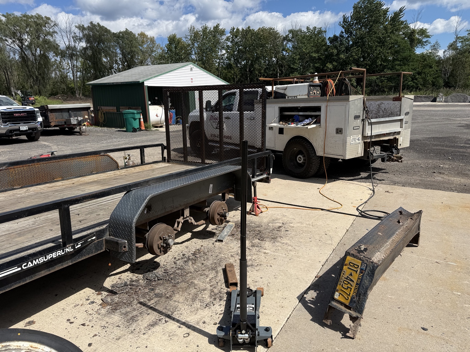 Mobile welding service repairing a utility trailer